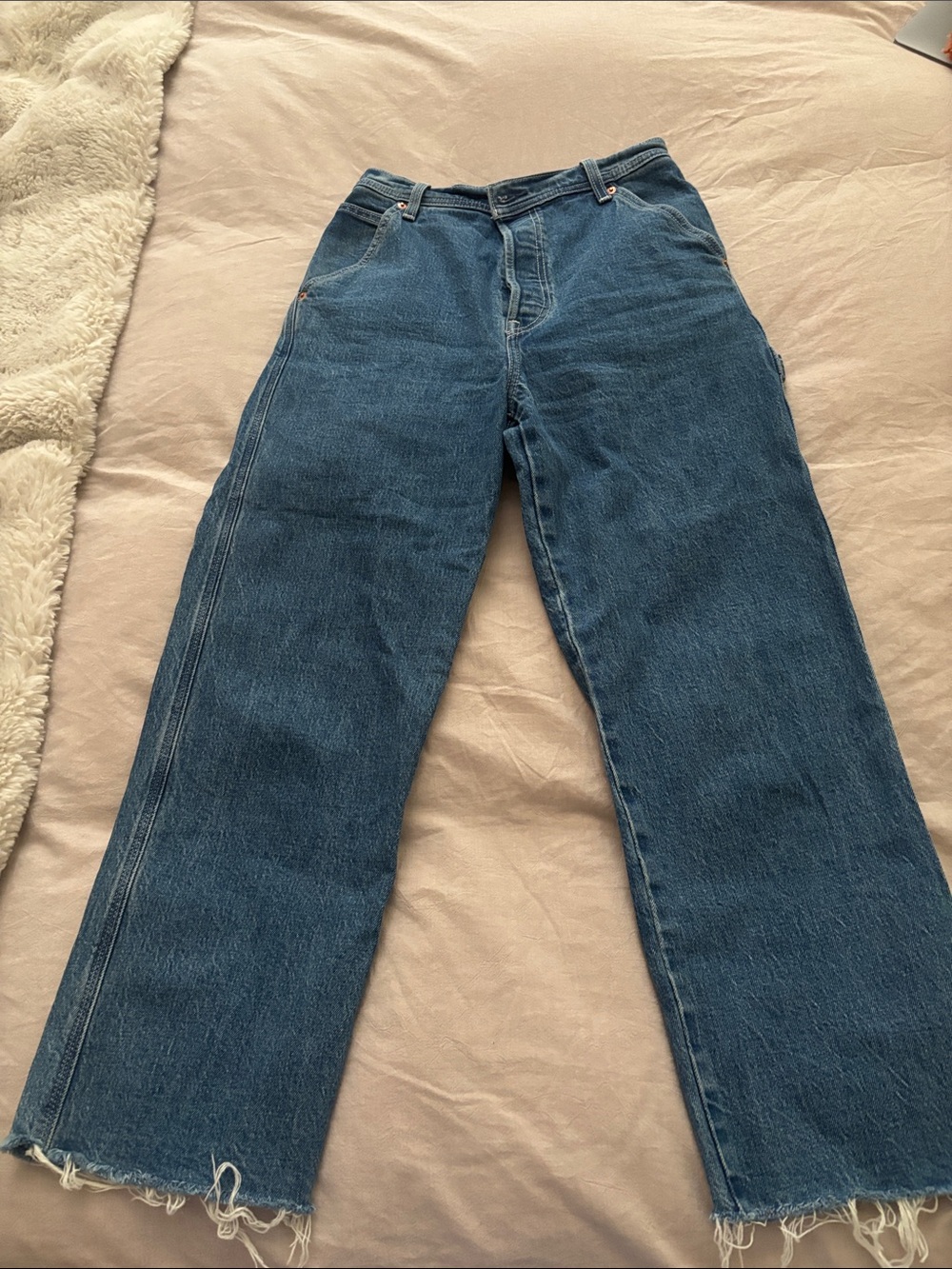 Levi's Straight-Leg Denim Jeans in Dark Blue with Raw Hem
